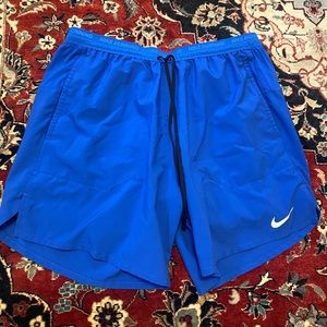 Nike Stride Shorts - size L - blue - with built in compression shorts.